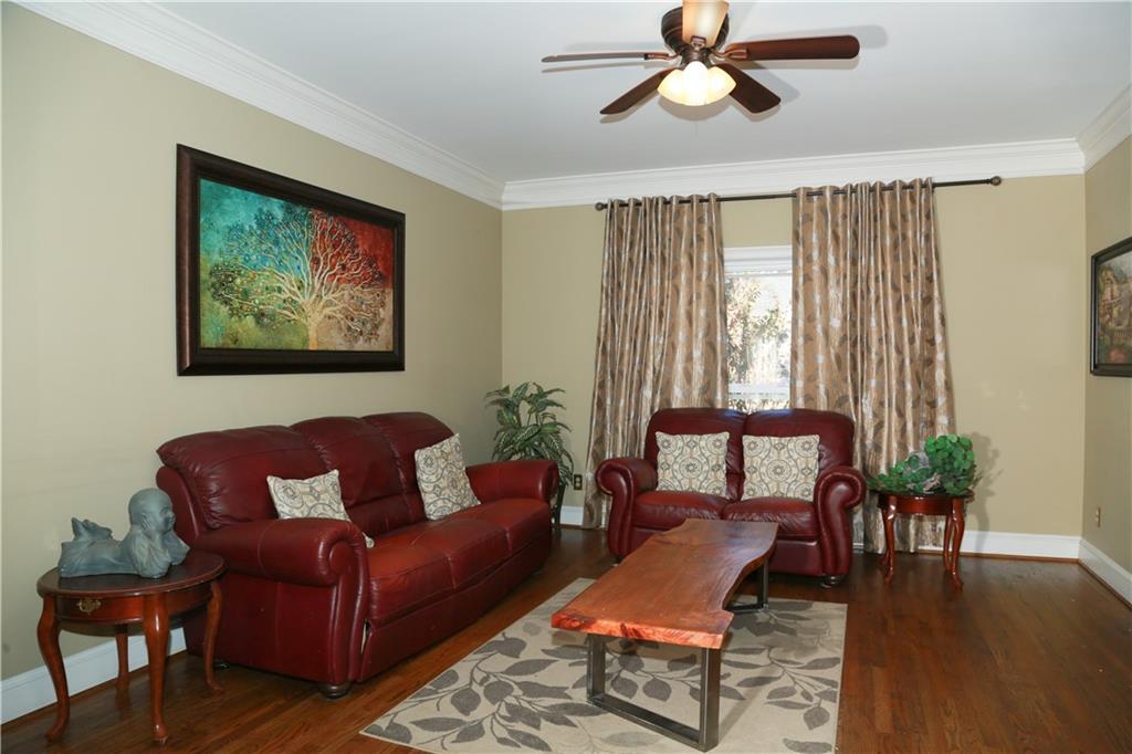 5735 Sunset Maple Drive Alpharetta, GA 30005 - Photo 14 of 39 a living room with furniture and a window