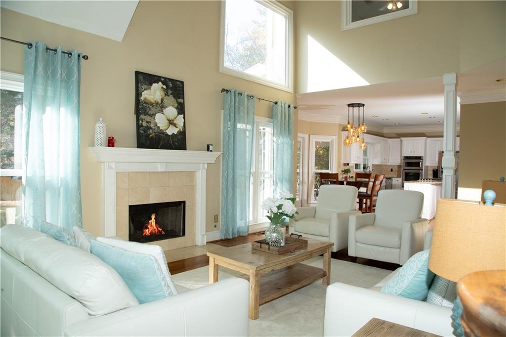 5735 Sunset Maple Drive Alpharetta, GA 30005 - Photo 15 of 39 a living room with furniture fireplace and window