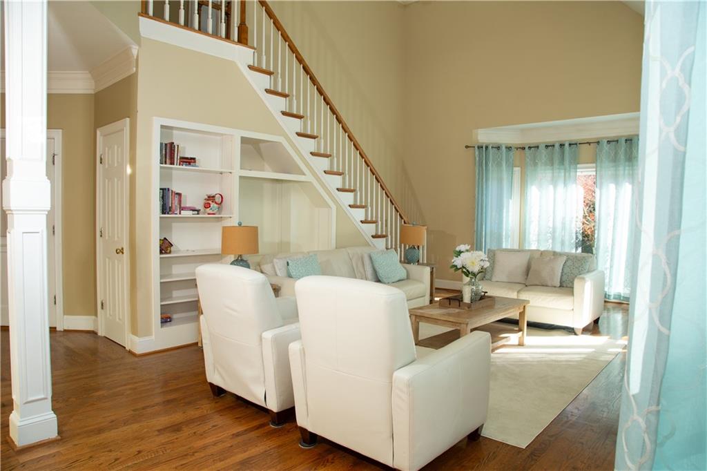 5735 Sunset Maple Drive Alpharetta, GA 30005 - Photo 16 of 39 a living room with furniture and a wooden floor