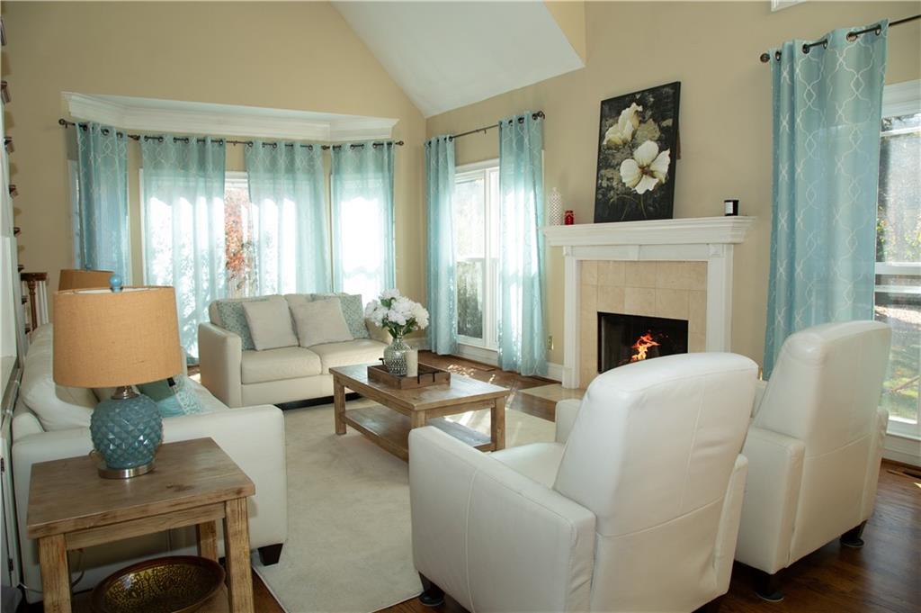 5735 Sunset Maple Drive Alpharetta, GA 30005 - Photo 17 of 39 a living room with furniture and a fireplace