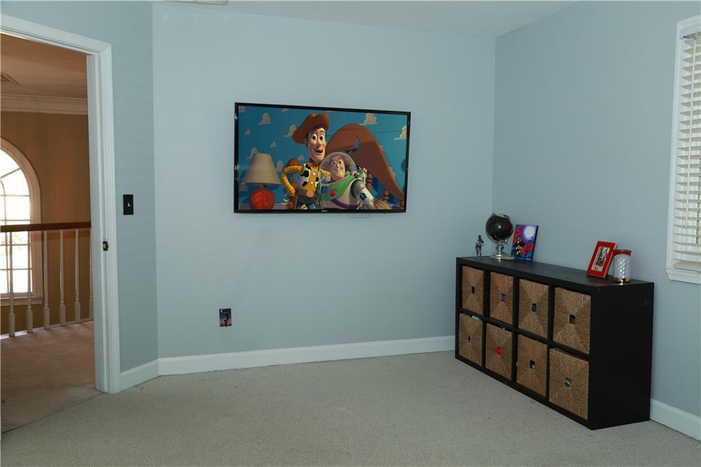 5735 Sunset Maple Drive Alpharetta, GA 30005 - Photo 28 of 39 a view of hallway with furniture and a gate