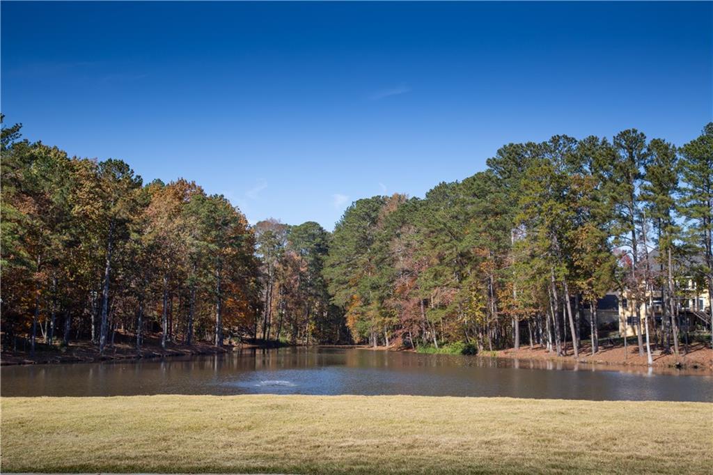 5735 Sunset Maple Drive Alpharetta, GA 30005 - Photo 35 of 39 a view of a swimming pool with an outdoor space and seating area