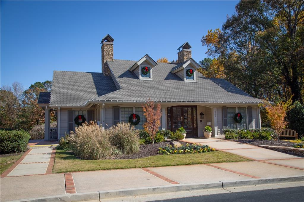 5735 Sunset Maple Drive Alpharetta, GA 30005 - Photo 39 of 39 a front view of a house with garden