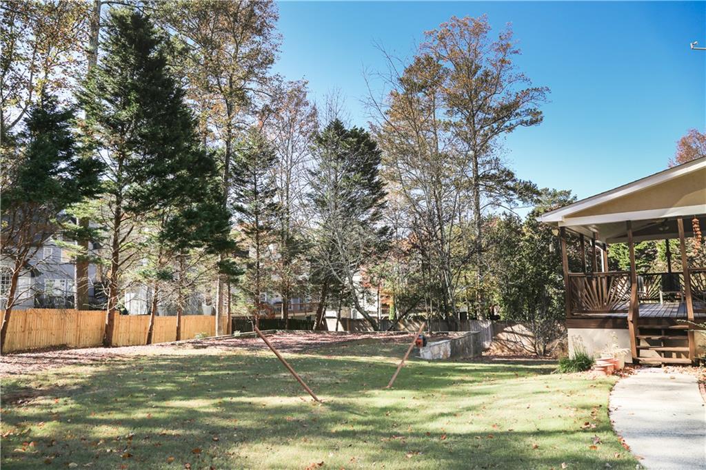 5735 Sunset Maple Drive Alpharetta, GA 30005 - Photo 9 of 39 a view of a swimming pool with an outdoor space