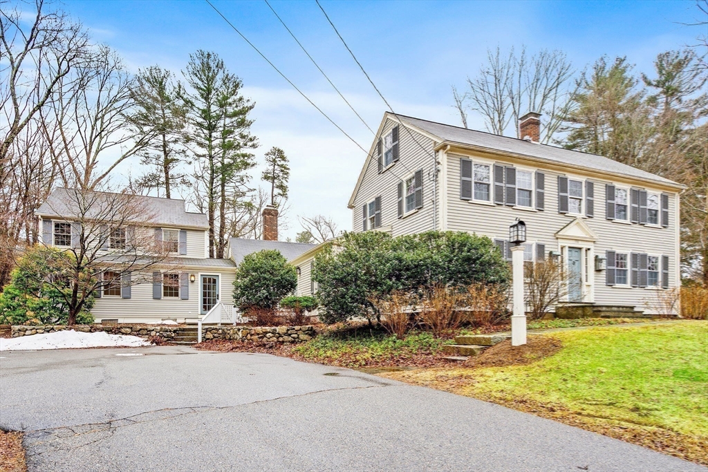 106 Lewis Avenue Walpole, MA 02081 - Photo 2 of 36 a front view of a building with street view