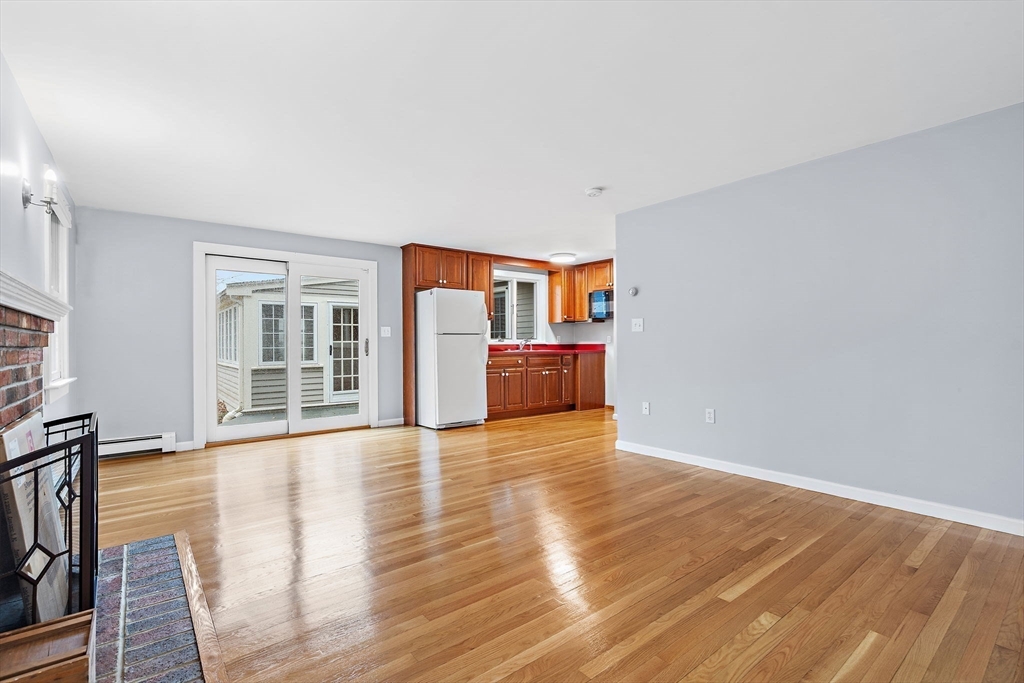 106 Lewis Avenue Walpole, MA 02081 - Photo 21 of 36 a view of empty room with wooden floor and fan