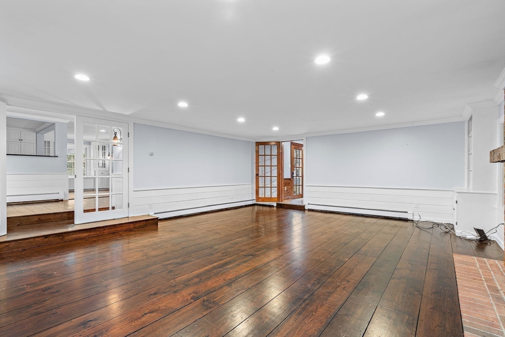 106 Lewis Avenue Walpole, MA 02081 - Photo 10 of 36 a view of empty room with wooden floor