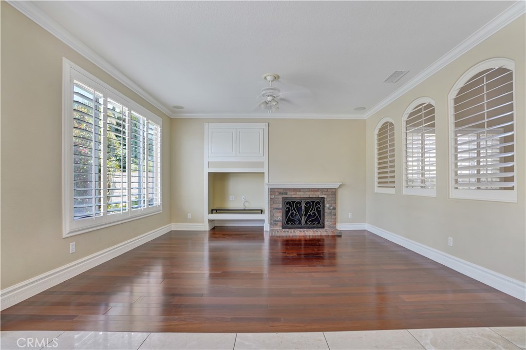 27585 Rosebud Way Laguna Niguel, CA 92677 - Photo 15 of 35 a view of empty room with fireplace and wooden floor