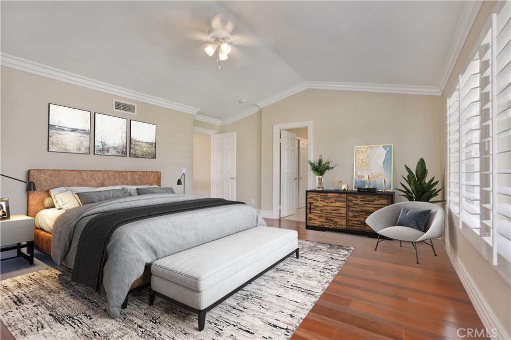 27585 Rosebud Way Laguna Niguel, CA 92677 - Photo 19 of 35 a spacious bedroom with a bed a couch and potted plant