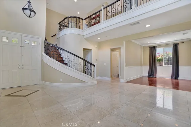 a view of an empty room with stairs and ventilation