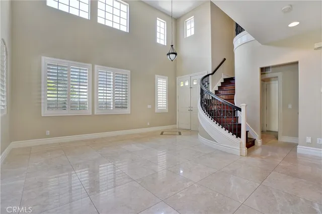 a kitchen with stainless steel appliances a stove refrigerator sink and cabinets
