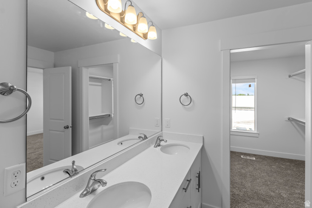 2995 South 265th Street West, Unit 752 Logan, UT 84321 - Photo 19 of 21 Double vanity with integrated sinks and chrome fixtures