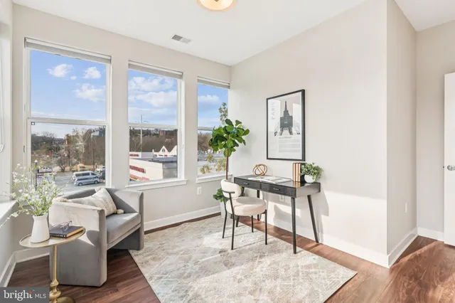 a work room with furniture and a window