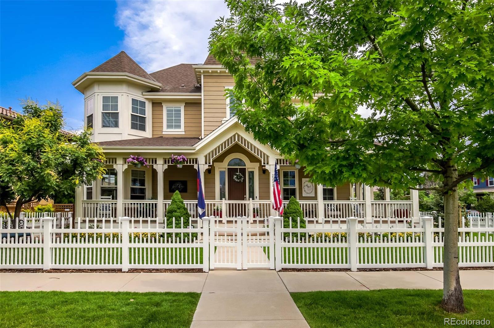 a front view of a house with a garden and plants