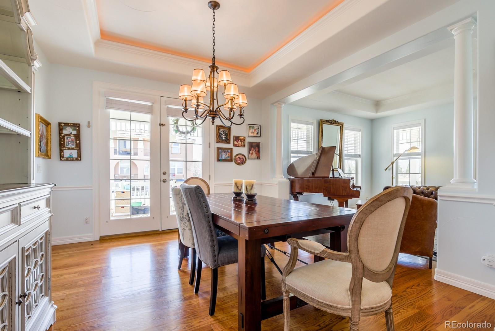 2322 Spruce Way Denver, CO 80238 - Photo 11 of 40 a view of a dining room with furniture window and wooden floor