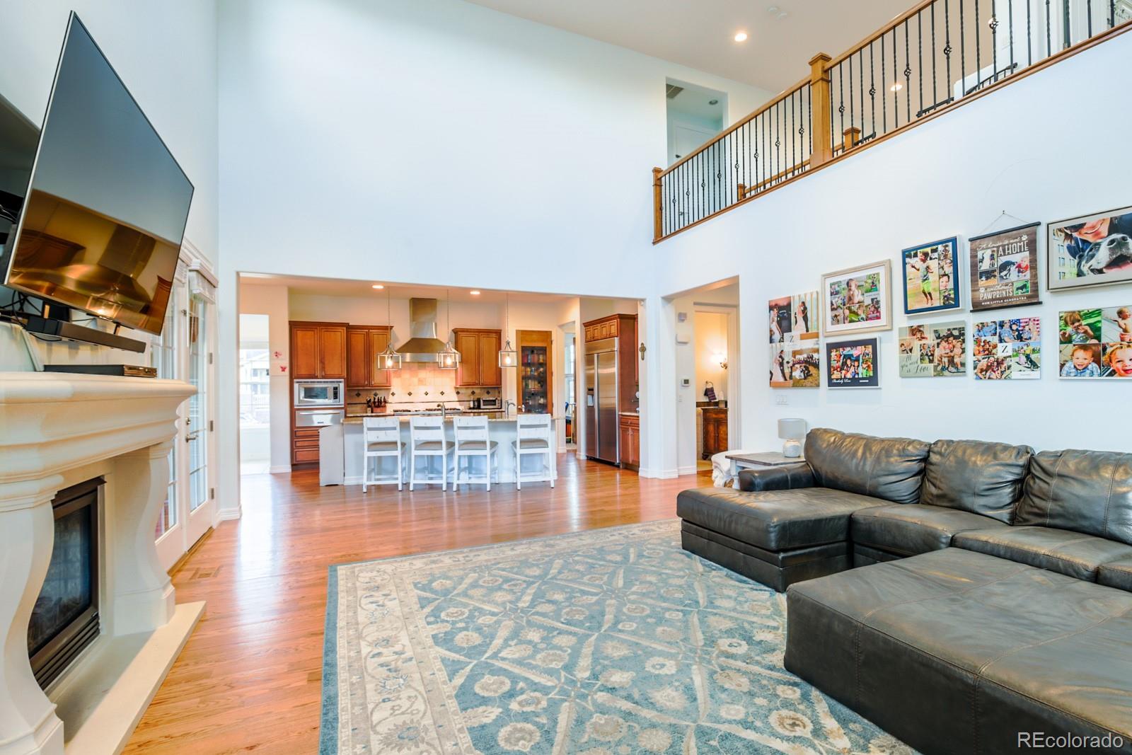 2322 Spruce Way Denver, CO 80238 - Photo 17 of 40 a living room with fireplace furniture and a flat screen tv