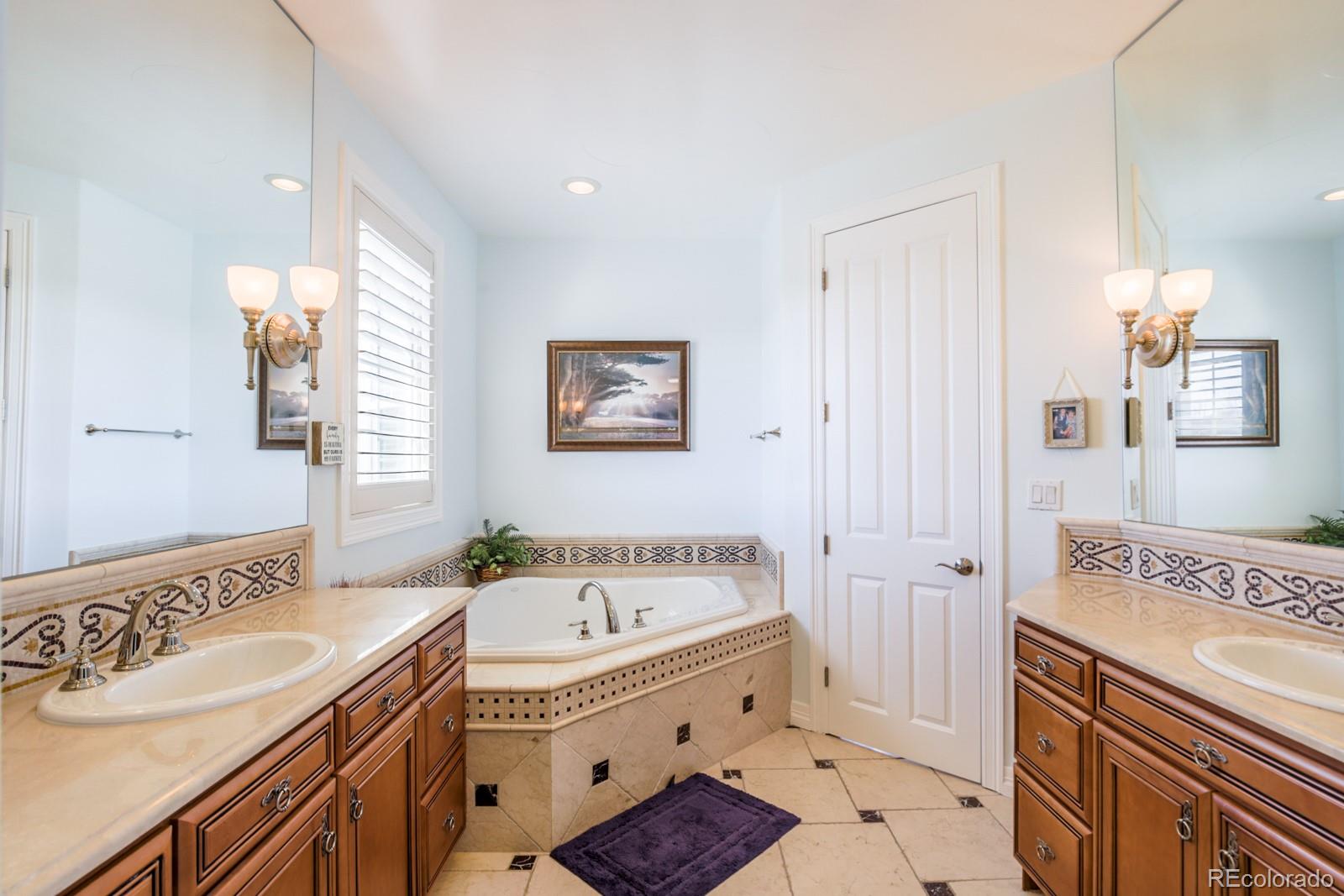2322 Spruce Way Denver, CO 80238 - Photo 25 of 40 a spacious bathroom with a tub sink and mirror