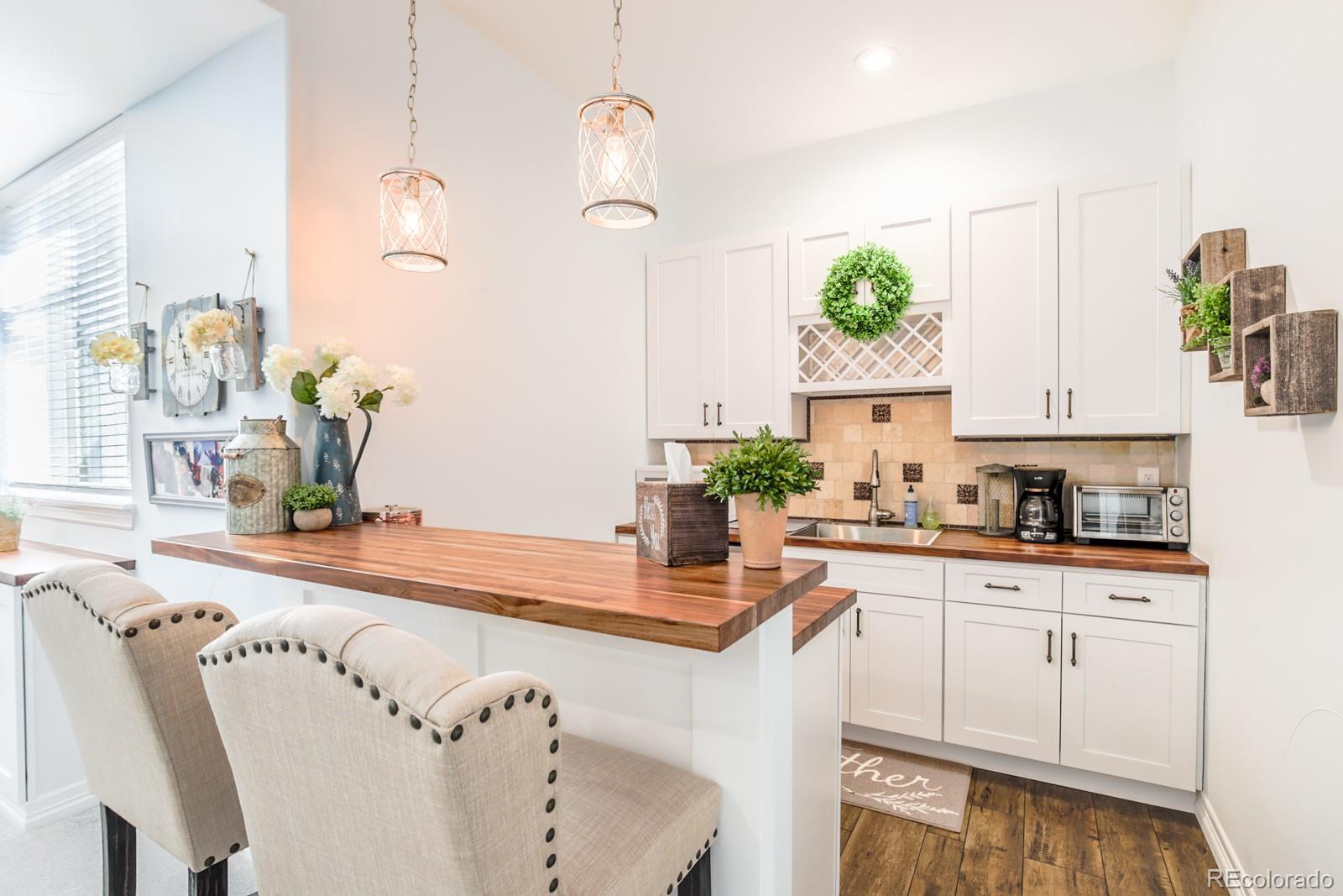 2322 Spruce Way Denver, CO 80238 - Photo 32 of 40 a kitchen with a white cabinets and window
