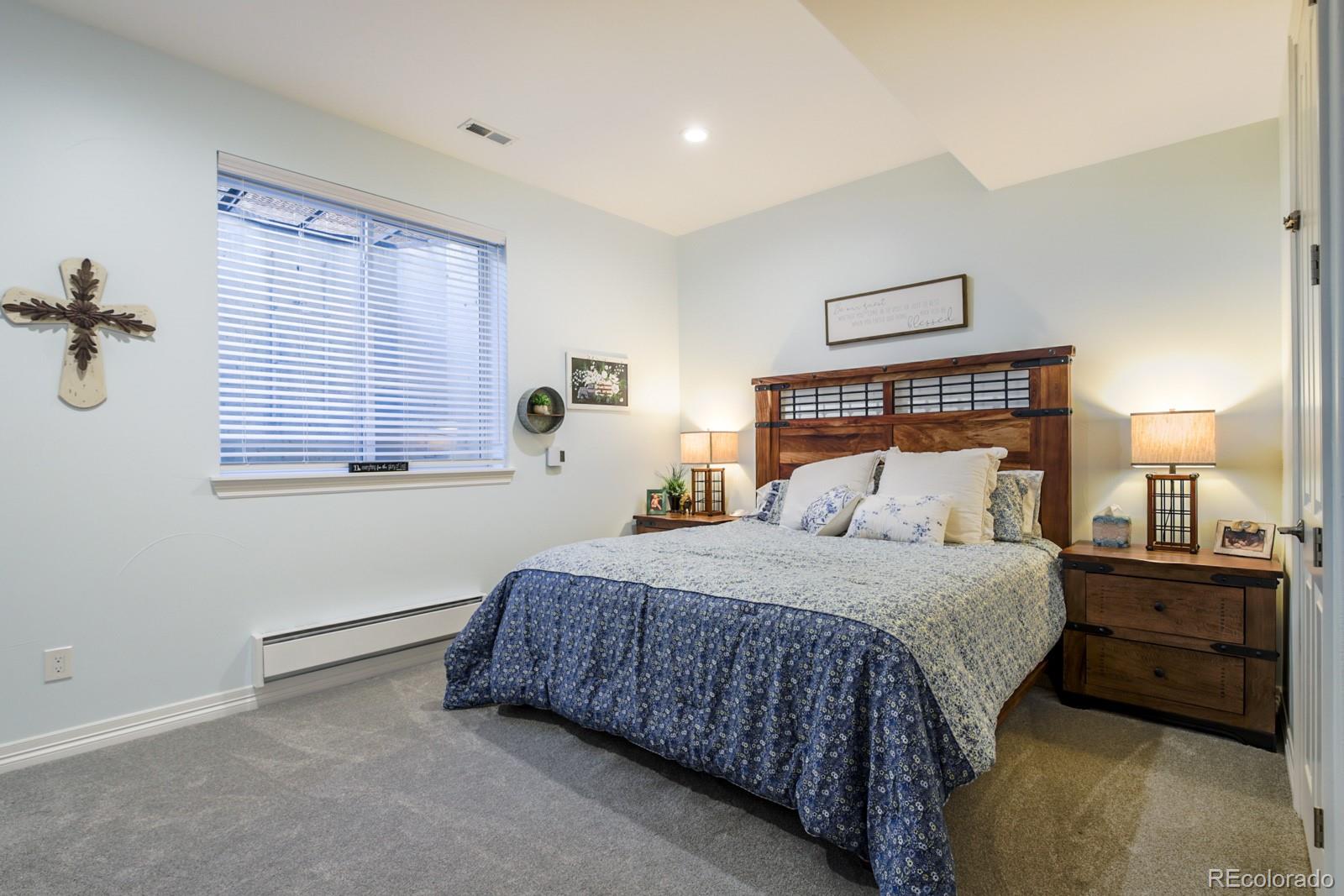 2322 Spruce Way Denver, CO 80238 - Photo 36 of 40 a bedroom with a bed and a window