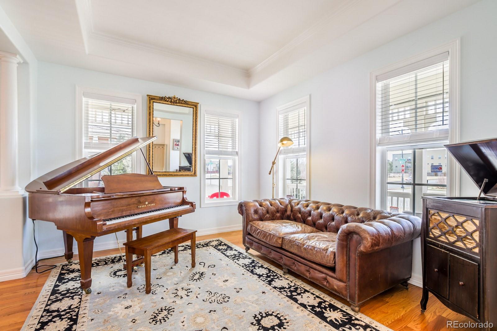 2322 Spruce Way Denver, CO 80238 - Photo 10 of 40 a living room with furniture a piano and a window