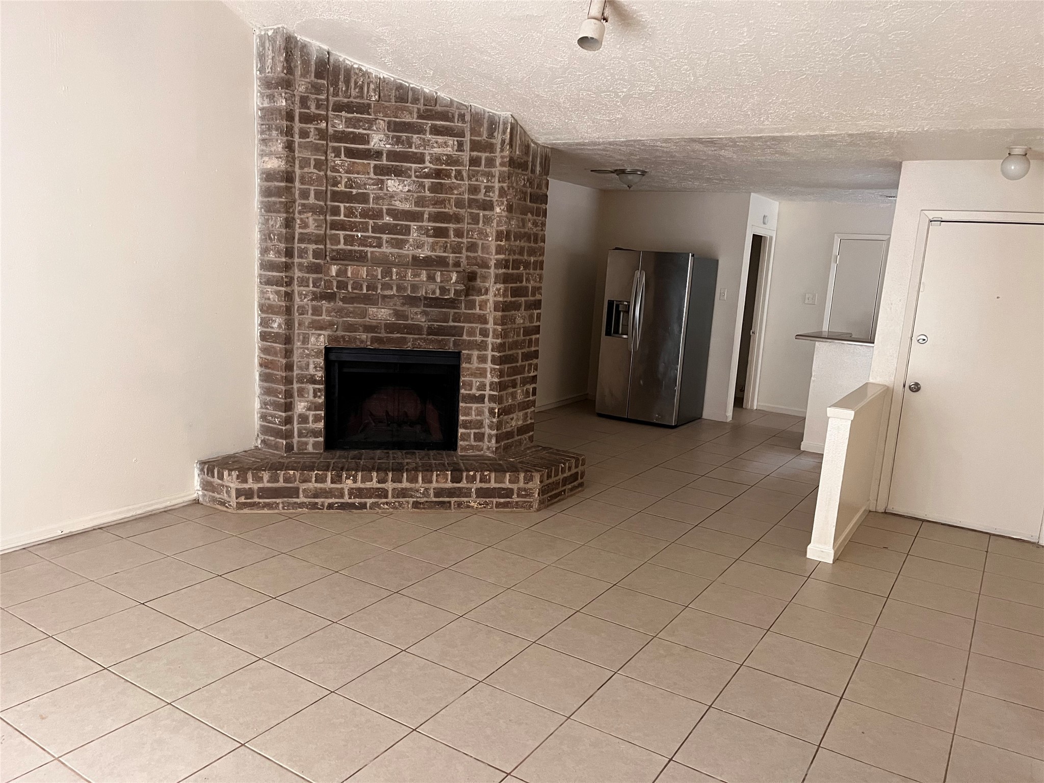 5415 Ridgemont Place Houston, TX 77053 - Photo 4 of 9 a living room with furniture and a fireplace