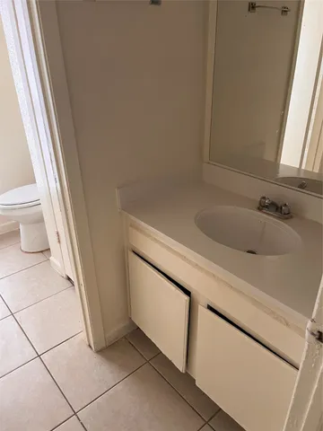 a bathroom with a sink and a vanity