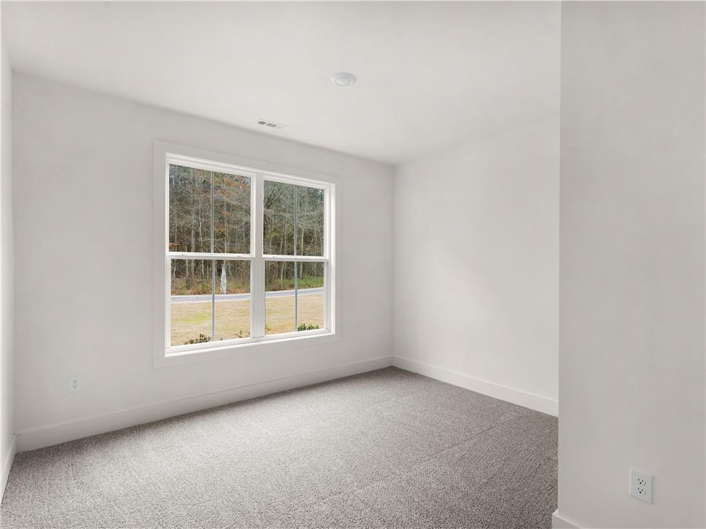 200 Loyd Road Mansfield, GA 30055 - Photo 19 of 54 an empty room with a window