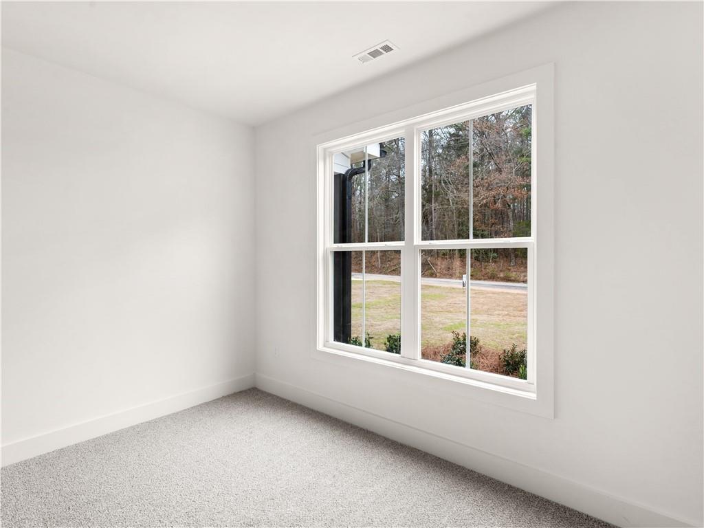 200 Loyd Road Mansfield, GA 30055 - Photo 20 of 54 a view of an empty room with a window