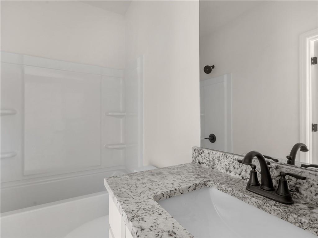 200 Loyd Road Mansfield, GA 30055 - Photo 23 of 54 a bathroom with a sink and a bathtub