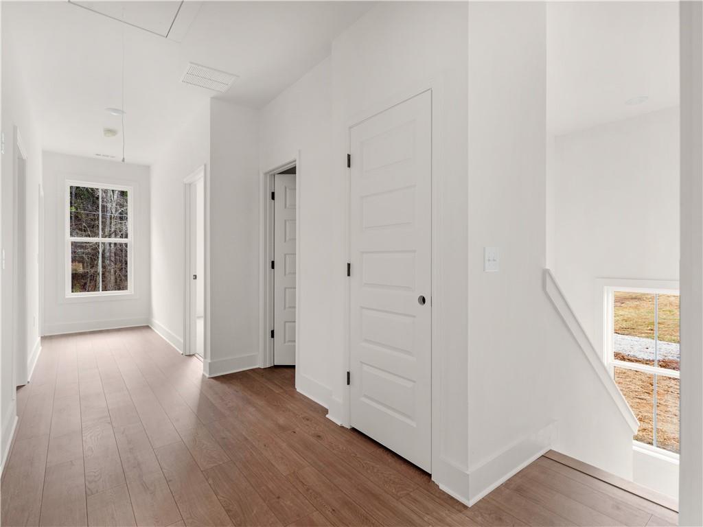 200 Loyd Road Mansfield, GA 30055 - Photo 25 of 54 a view of an empty room with wooden floor and a window