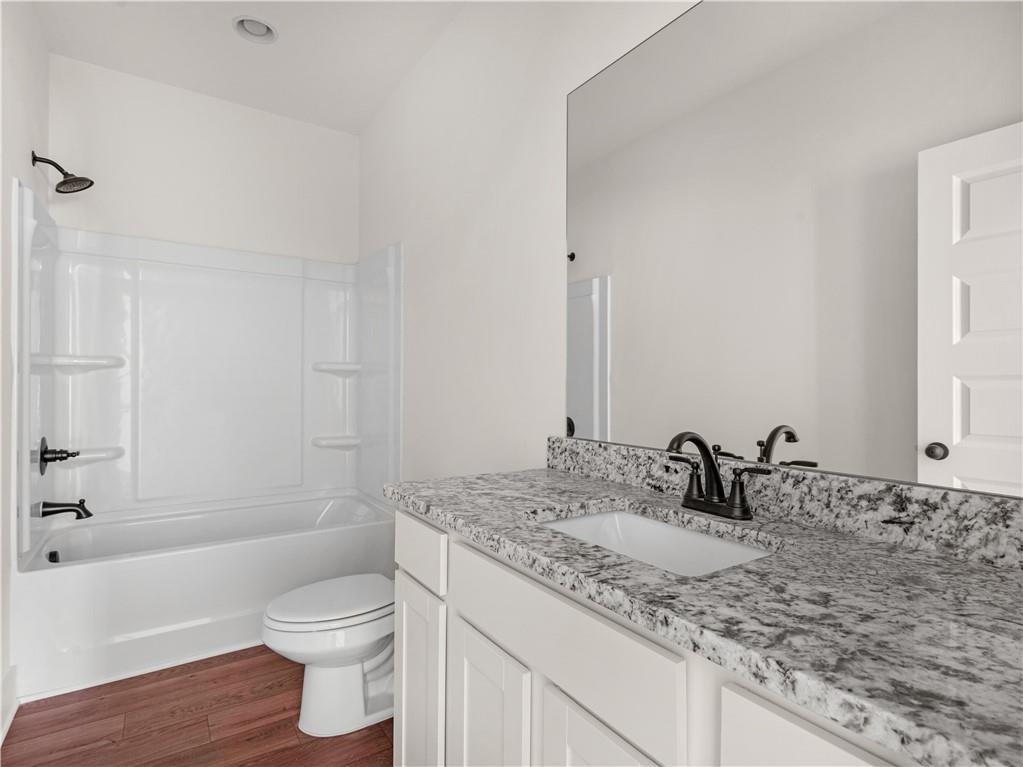 200 Loyd Road Mansfield, GA 30055 - Photo 27 of 54 a bathroom with a granite countertop sink toilet and shower