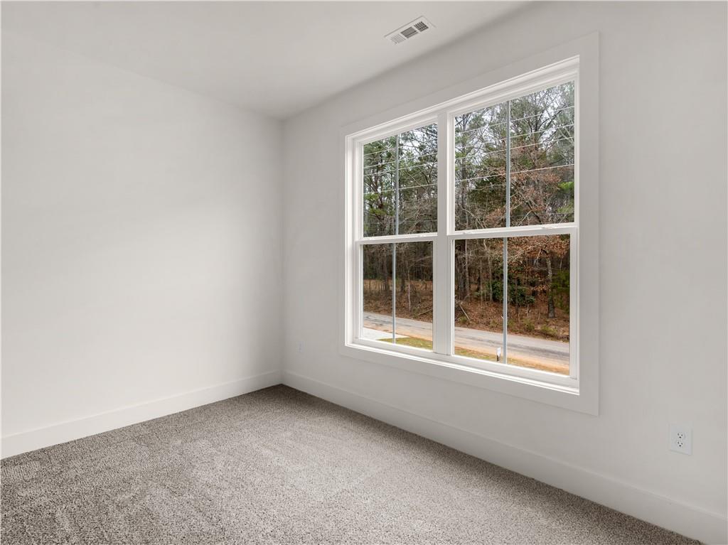 200 Loyd Road Mansfield, GA 30055 - Photo 29 of 54 an empty room with a window