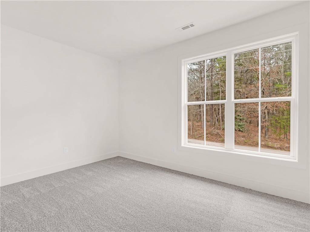 200 Loyd Road Mansfield, GA 30055 - Photo 36 of 54 an empty room with a window