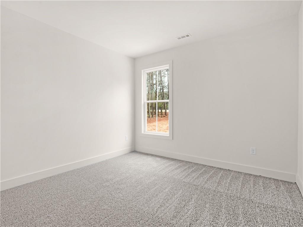 200 Loyd Road Mansfield, GA 30055 - Photo 39 of 54 an empty room with a window