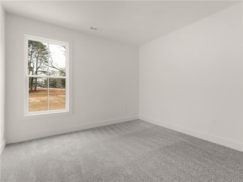 200 Loyd Road Mansfield, GA 30055 - Photo 42 of 54 an empty room with a window
