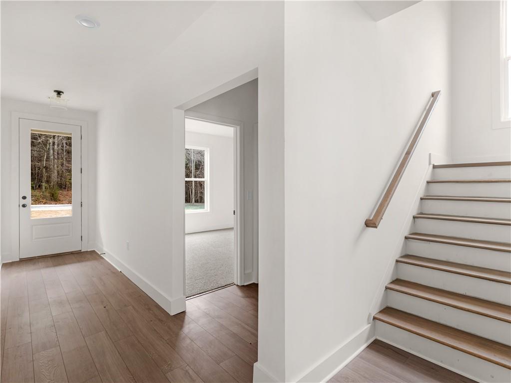 200 Loyd Road Mansfield, GA 30055 - Photo 5 of 54 a view of a hallway with wooden floor and entryway