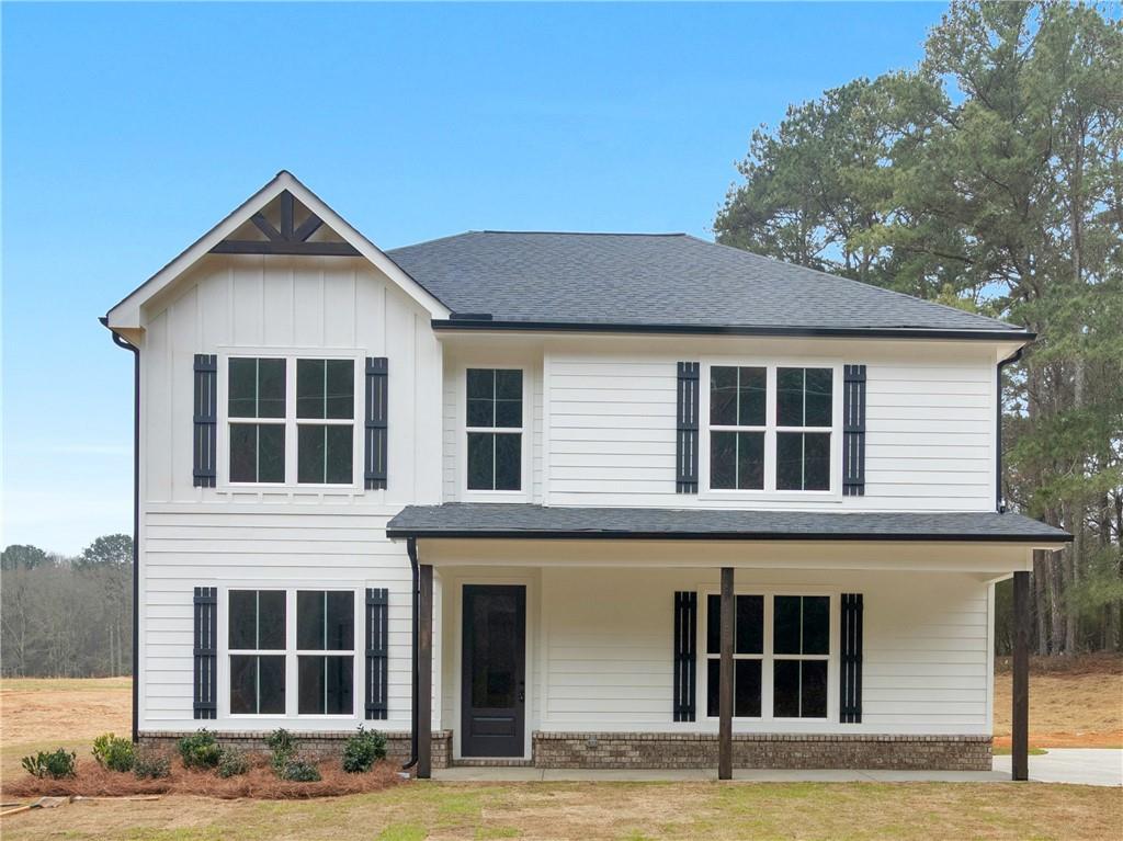 200 Loyd Road Mansfield, GA 30055 - Photo 51 of 54 a front view of a house with yard and parking