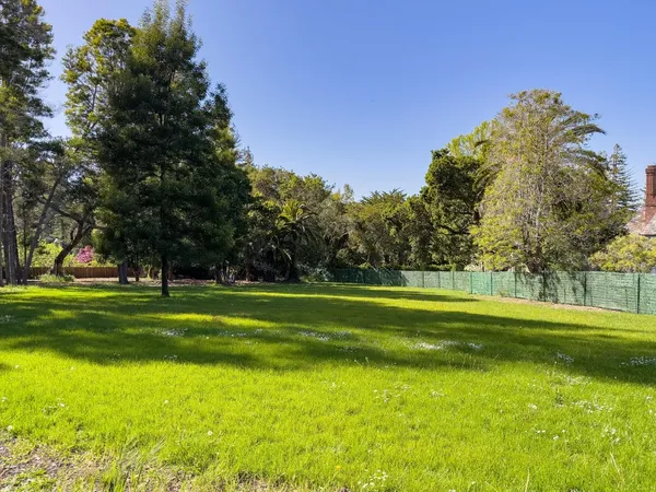 a view of a golf course with a trees