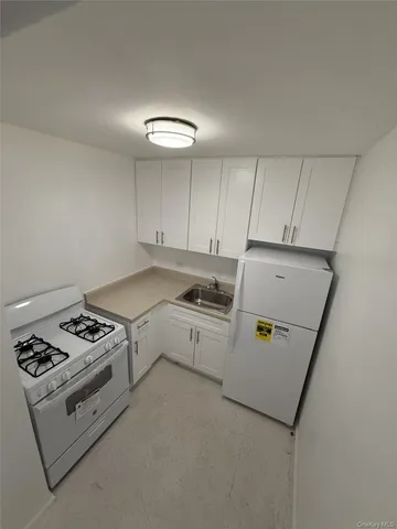 a kitchen that has a sink and a stove
