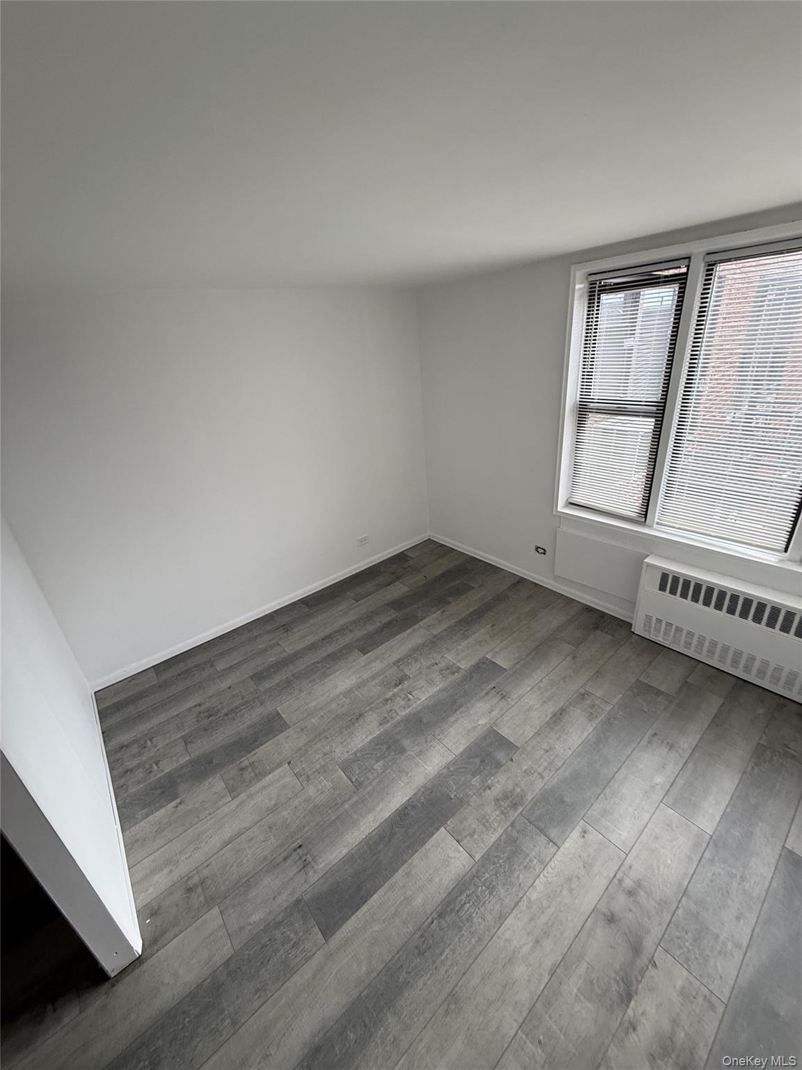83-30 Vietor Avenue, Unit 727 Queens, NY 11373 - Photo 6 of 11 a view of an empty room with a window