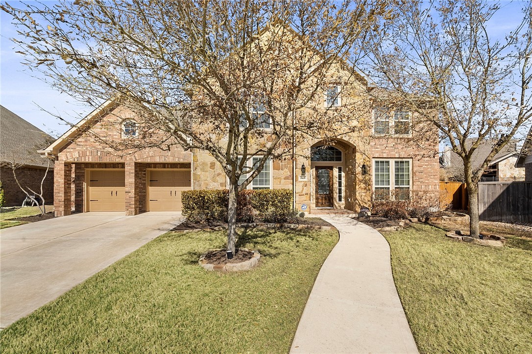 a front view of a house with yard patio and outdoor seating