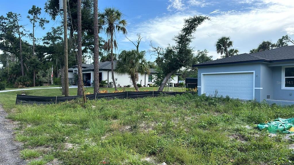 199 Statler Street Port Charlotte, FL 33954 - Photo 14 of 33 a view of backyard of house with green space