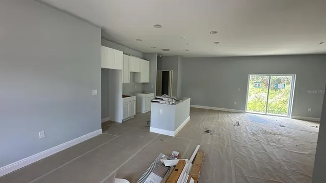a view of a kitchen cabinets and a window