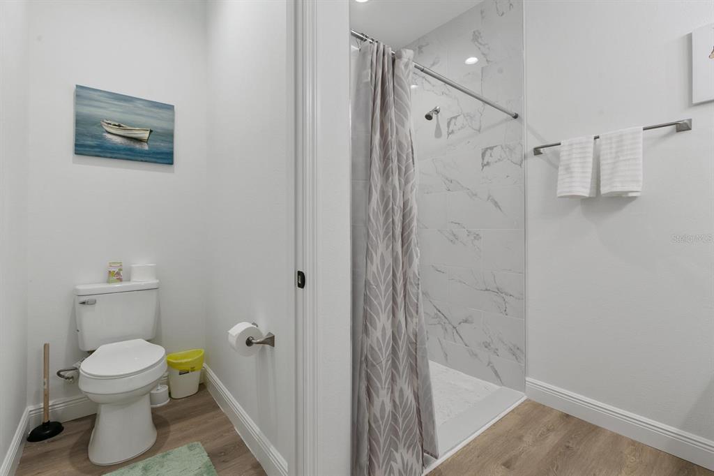 199 Statler Street Port Charlotte, FL 33954 - Photo 33 of 33 a bathroom with a shower and a toilet