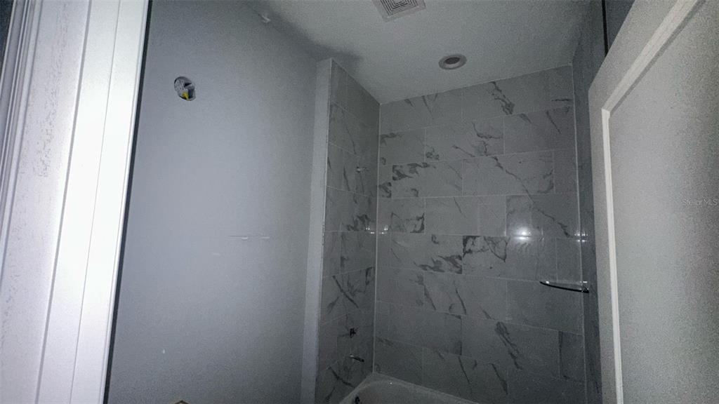 199 Statler Street Port Charlotte, FL 33954 - Photo 6 of 33 a bathroom with a shower
