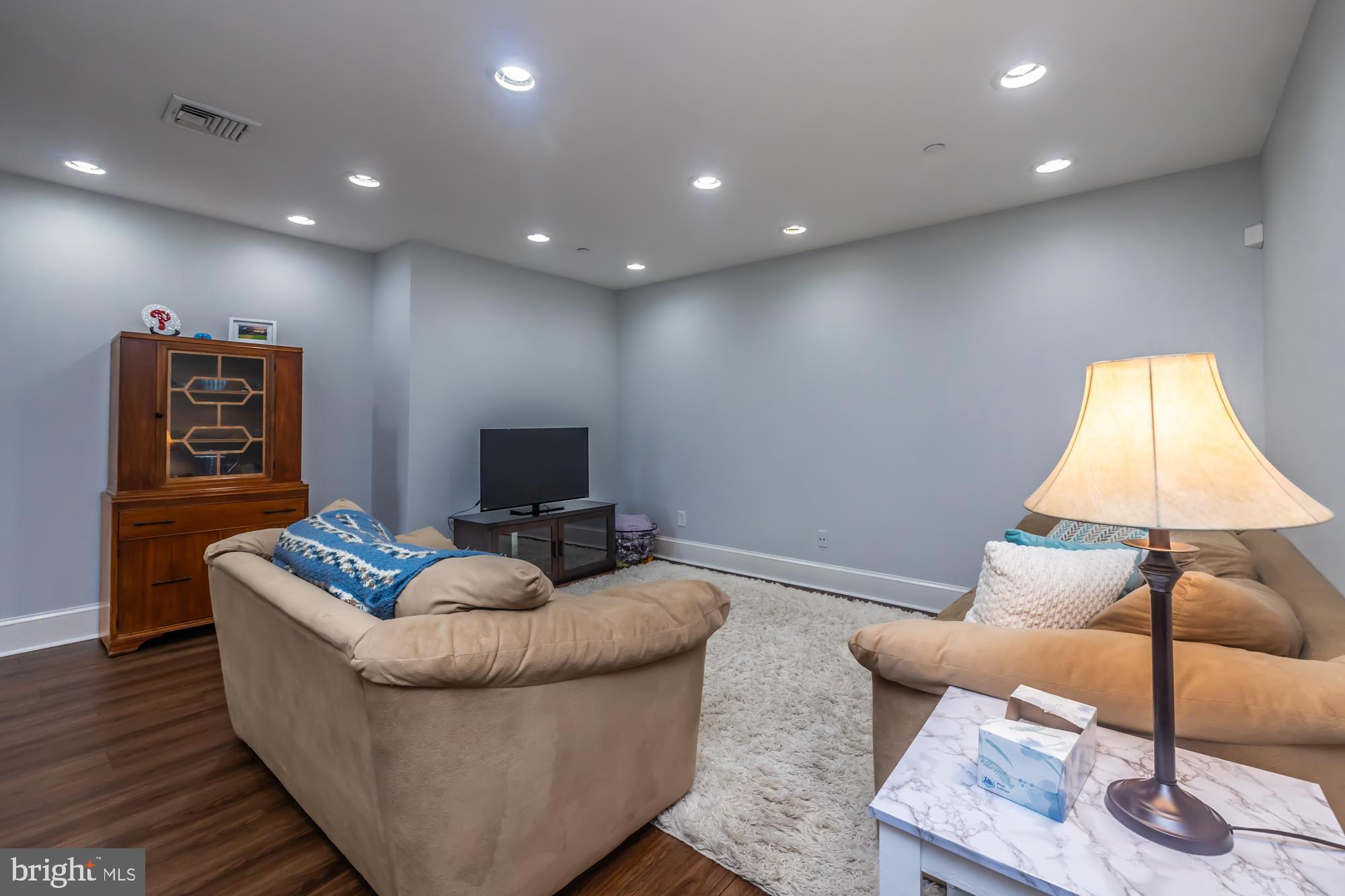 212 Idris Road, Unit Z1 Merion Station, PA 19066 - Photo 11 of 35 a living room with furniture and a flat screen tv