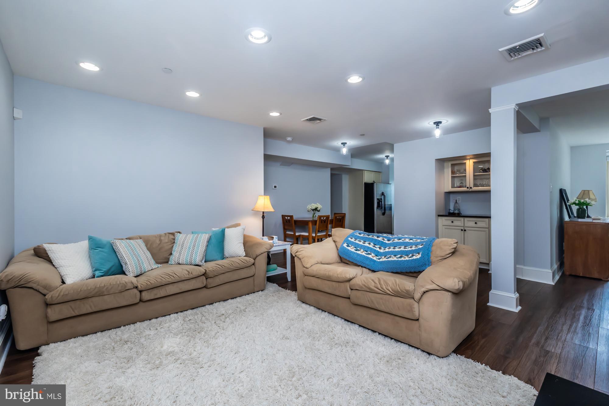 212 Idris Road, Unit Z1 Merion Station, PA 19066 - Photo 12 of 35 a living room with furniture and wooden floor