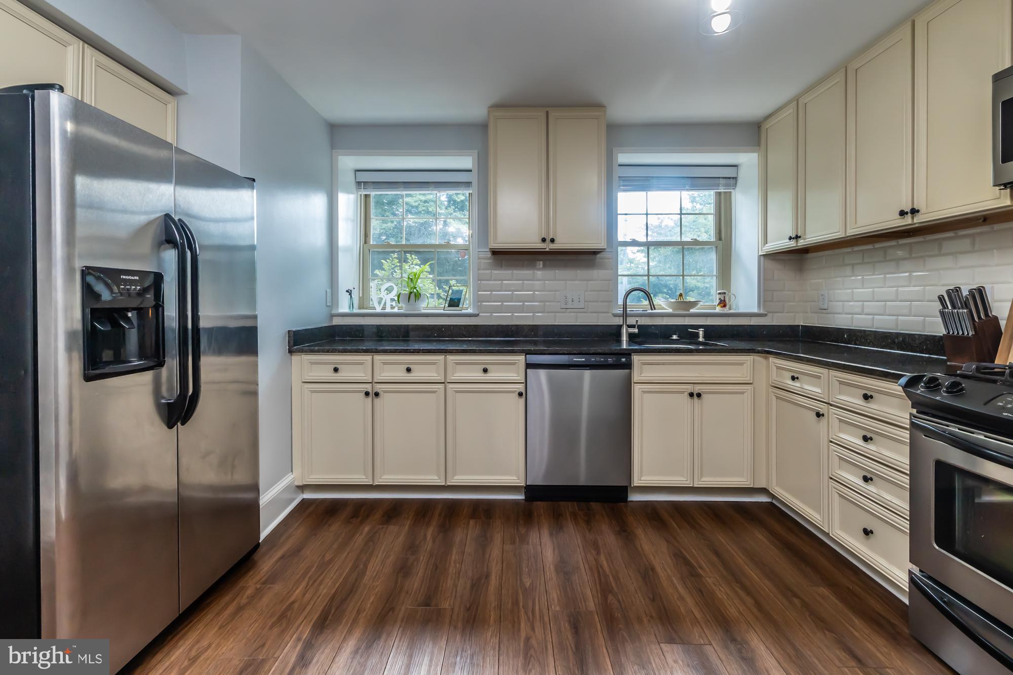 212 Idris Road, Unit Z1 Merion Station, PA 19066 - Photo 18 of 35 a kitchen with a sink window and stainless steel appliances