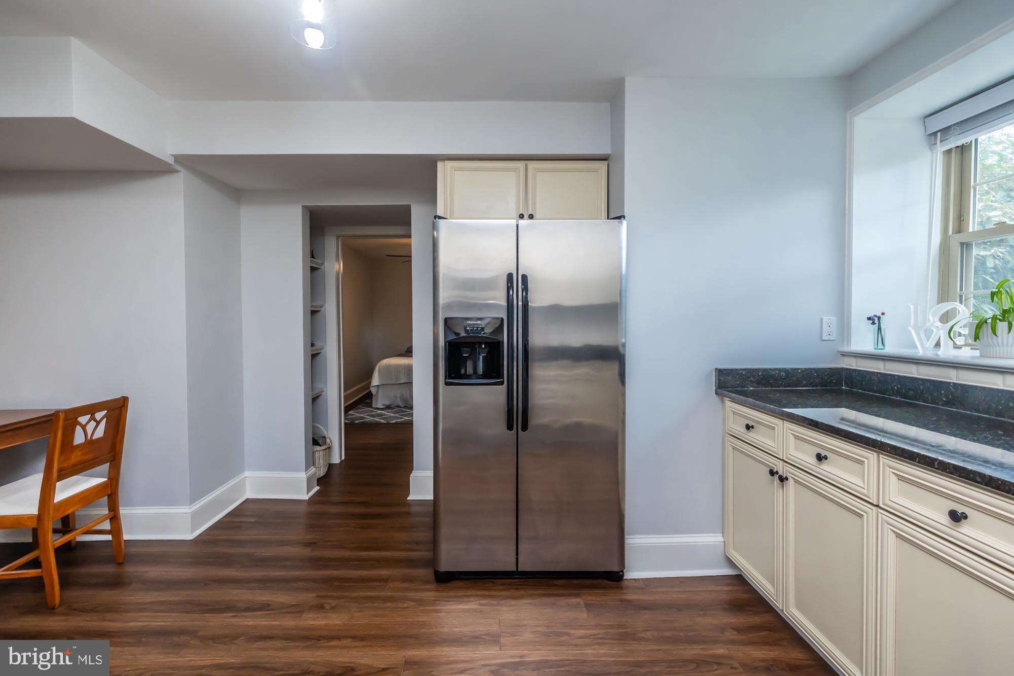 212 Idris Road, Unit Z1 Merion Station, PA 19066 - Photo 20 of 35 a kitchen with granite countertop a refrigerator and a stove top oven
