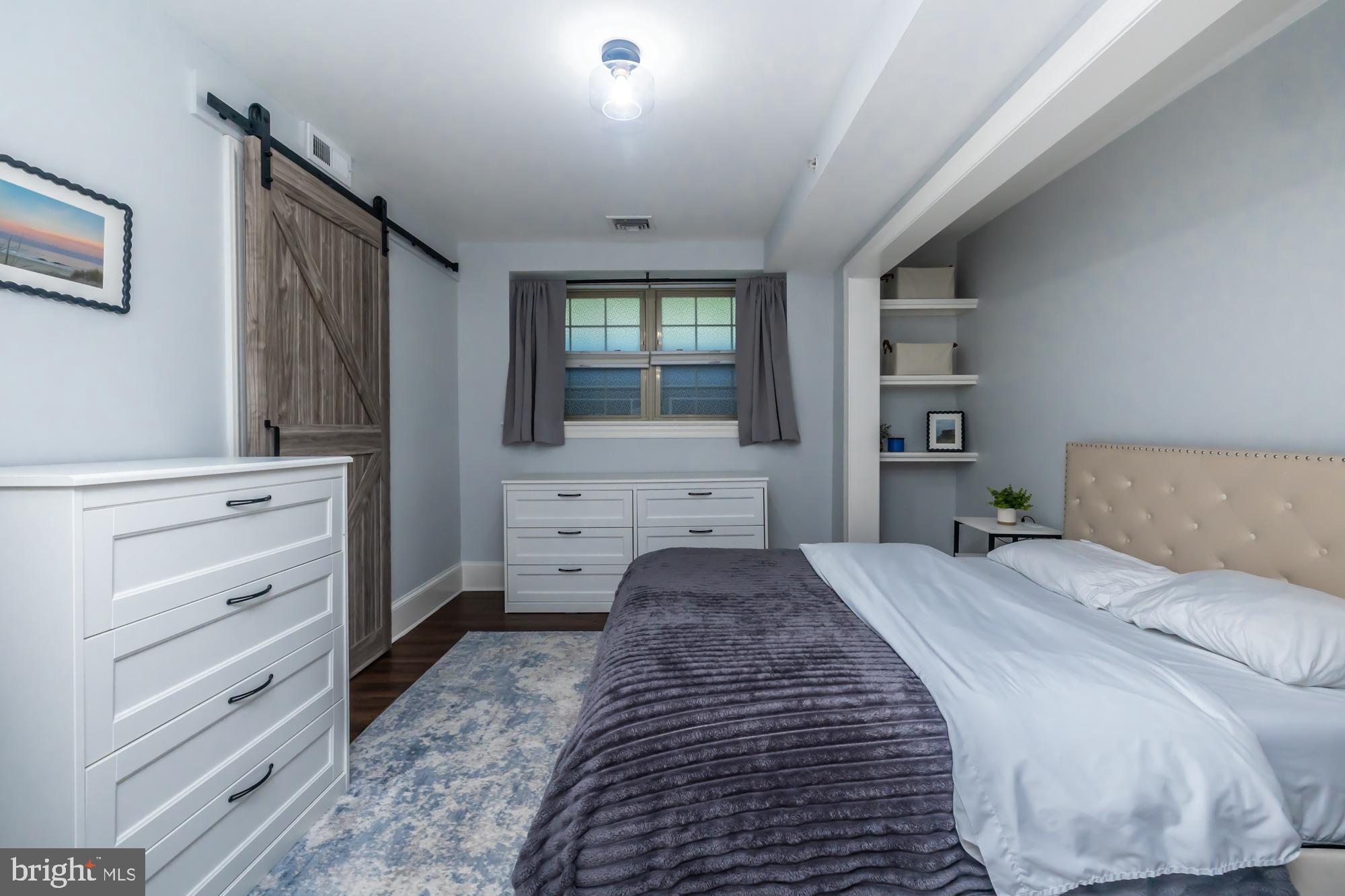 212 Idris Road, Unit Z1 Merion Station, PA 19066 - Photo 27 of 35 a bedroom with a bed and a dresser